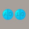 "Bottles of Adderall prescription medication on a white background."