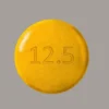 "Authentic Adderall 12.5 mg immediate-release prescription tablets next to pharmacy bottle"