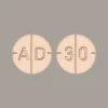 "High-strength Adderall 30mg prescription tablets inside a pharmacy bottle"