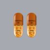"Adderall XR 30mg extended-release capsules on a professional pharmacy surface"