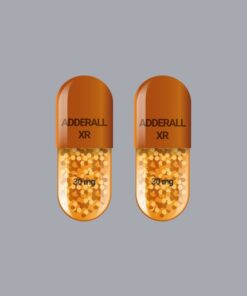 "Adderall XR 30mg extended-release capsules on a professional pharmacy surface"